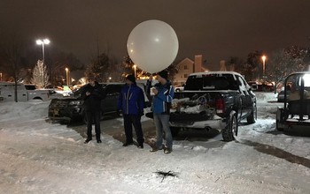 Researchers from the University of Illinois at Urbana-Champaign prepare to launch an instrument package.